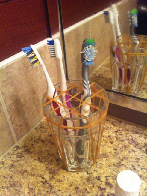 toothbrushes divided by elastic bands in a grid