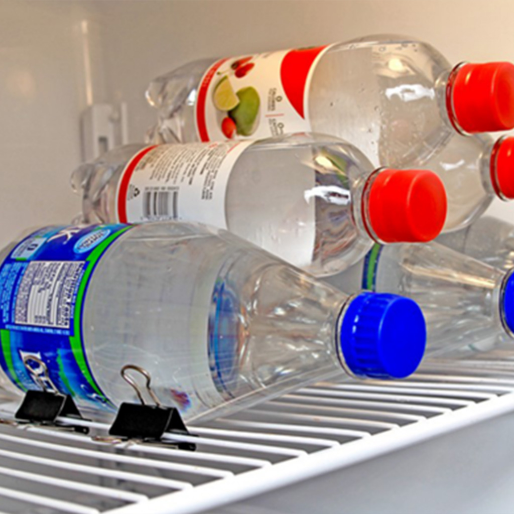 using binder clips to stack bottles in the fridge