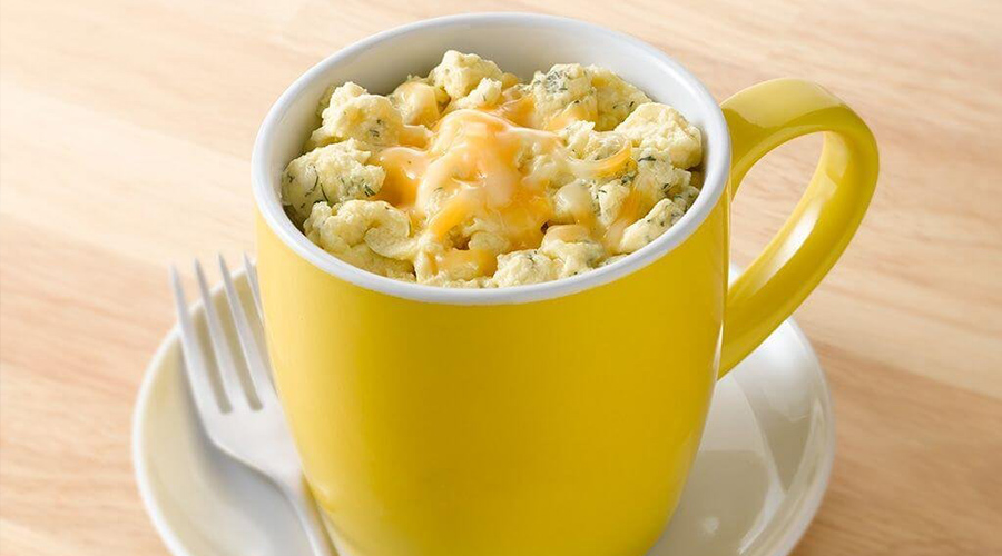 scrambled eggs cooked in a mug in the microwave
